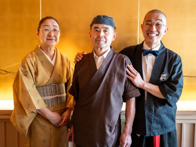 Father Tetsuya Oda (center) and owner Tetsu (right).
