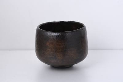 Black raku tea bowl glazed with natural iron-rich stones from the upper reaches of Kibune.